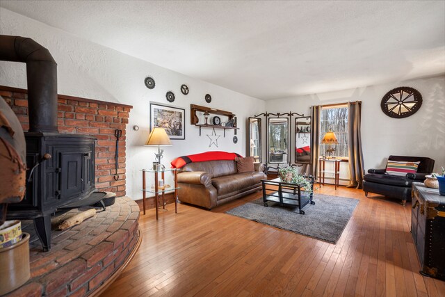 7630 Dilley Rd, Davisburg, MI 48350 - living room with a wood stove and hardwood / wood-style flooring