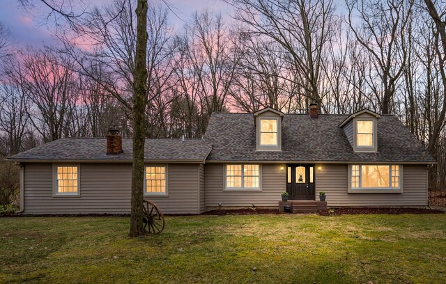 7630 Dilley Rd, Davisburg, MI 48350 - cape cod house with a chimney, a front lawn, and roof with shingles