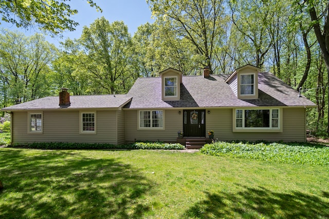 7630 Dilley Rd, Davisburg, MI 48350 - cape cod house featuring a chimney, a front lawn, and a shingled roof