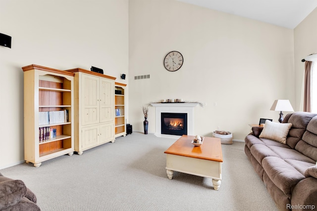 5280 Brantford, Grand Blanc, MI 48439 - living area with high vaulted ceiling, light colored carpet, and a fireplace with flush hearth