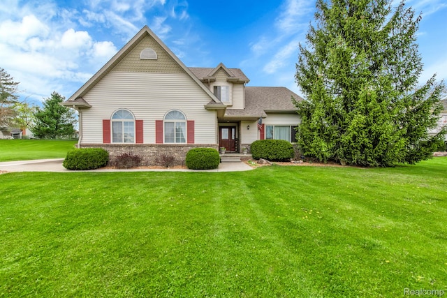 5280 Brantford, Grand Blanc, MI 48439 - view of front of house featuring a front yard, brick siding, and a shingled roof