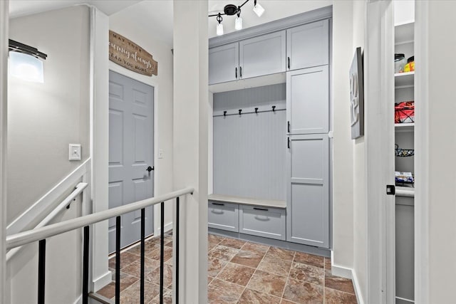 mudroom featuring stone finish flooring