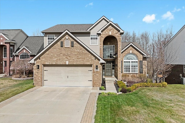 traditional-style home featuring driveway, a front lawn, brick siding, and a garage