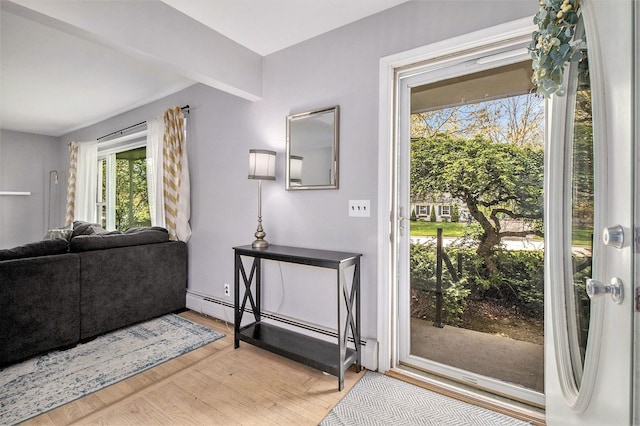 entryway featuring a baseboard radiator and light wood-style floors