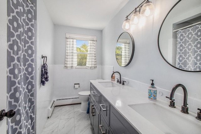 full bathroom with tile walls, toilet, a baseboard heating unit, marble finish flooring, and double vanity