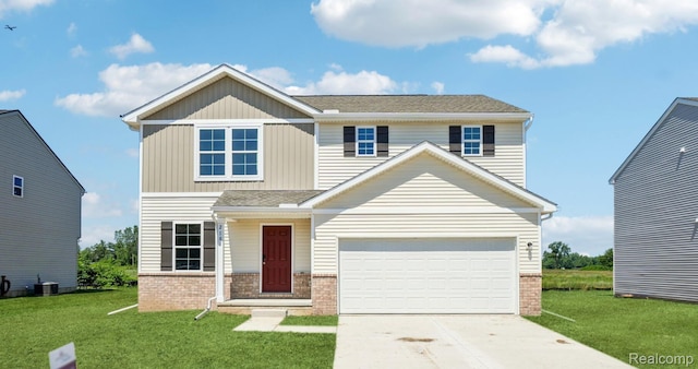 2181 Gunnison Ln, Monroe, MI 48162 - view of front of house with brick siding, a front lawn, and driveway
