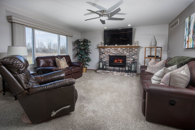 living room with recessed lighting, visible vents, carpet floors, a brick fireplace, and ceiling fan