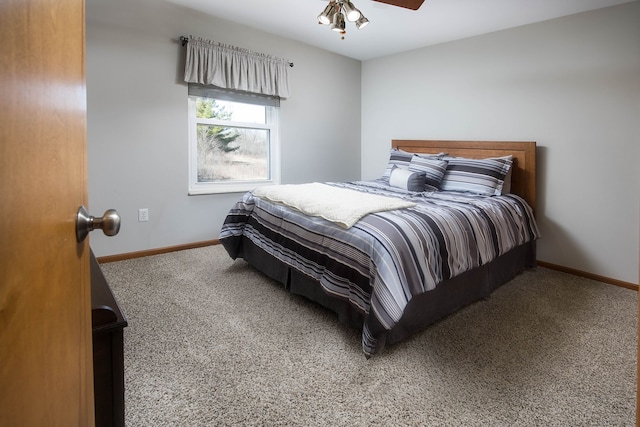 carpeted bedroom with baseboards and ceiling fan