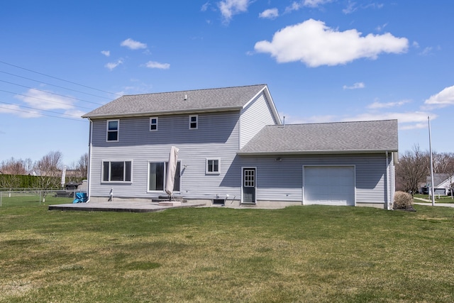 back of property with a garage, a lawn, fence, and roof with shingles
