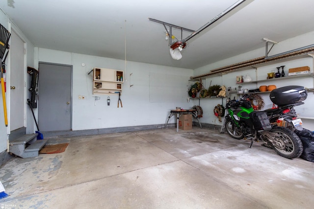 6051 Homestead Pl, Grand Blanc, MI 48439 - garage featuring a garage door opener