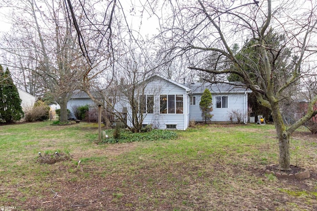 6051 Homestead Pl, Grand Blanc, MI 48439 - view of home's exterior with a lawn