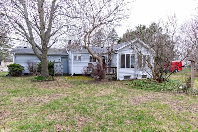 6051 Homestead Pl, Grand Blanc, MI 48439 - back of house featuring a deck and a lawn