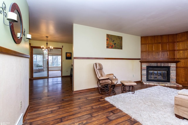 6051 Homestead Pl, Grand Blanc, MI 48439 - living area with dark wood-type flooring, baseboards, a notable chandelier, and a brick fireplace