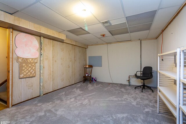 6051 Homestead Pl, Grand Blanc, MI 48439 - below grade area with a paneled ceiling, carpet flooring, wood walls, stairs, and visible vents