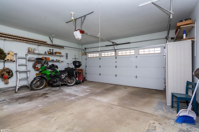6051 Homestead Pl, Grand Blanc, MI 48439 - garage featuring a garage door opener