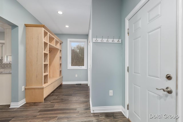 mudroom featuring baseboards, dark wood finished floors, and recessed lighting