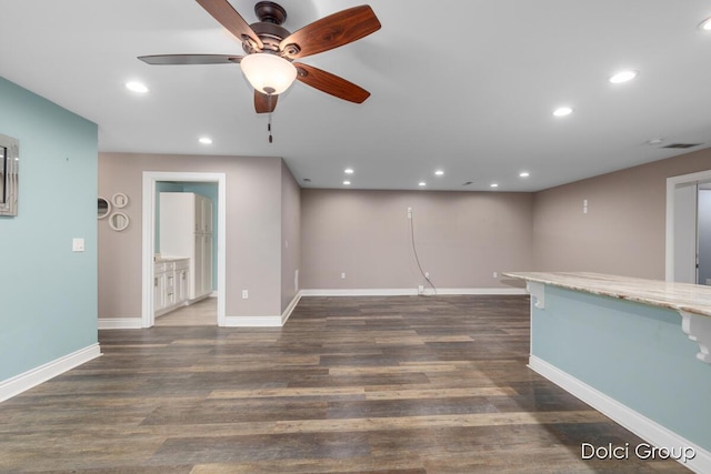 unfurnished living room featuring baseboards, recessed lighting, ceiling fan, and wood finished floors