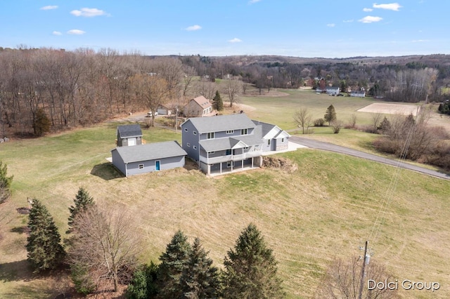 birds eye view of property with a rural view