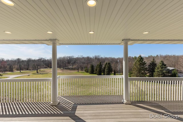 wooden deck with a yard