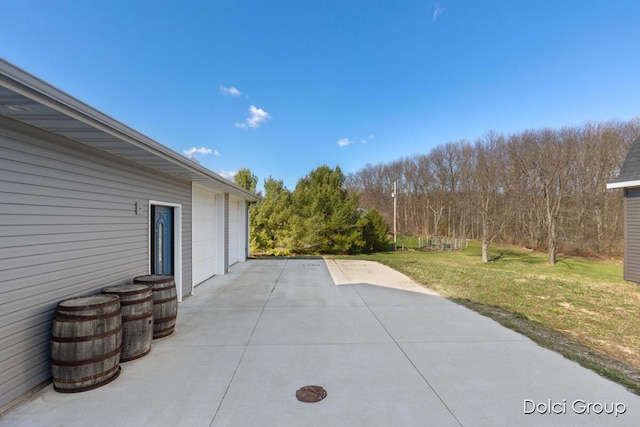 view of patio featuring a garage