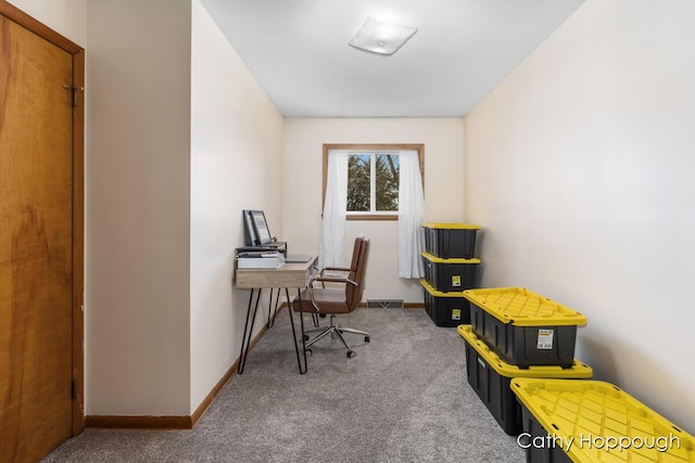 carpeted home office featuring baseboards and visible vents