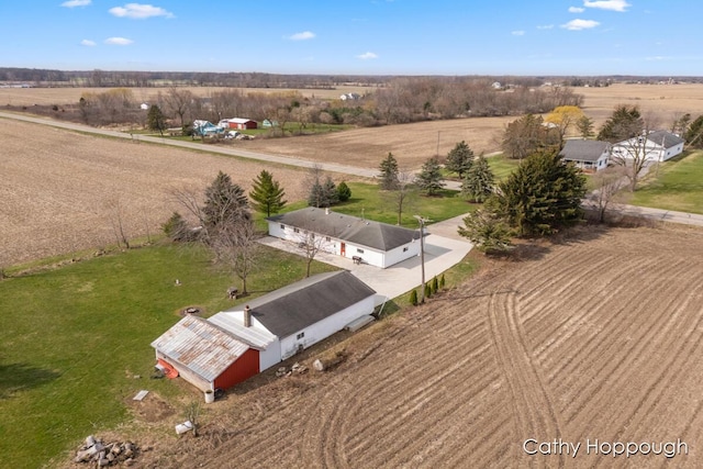 birds eye view of property with a rural view