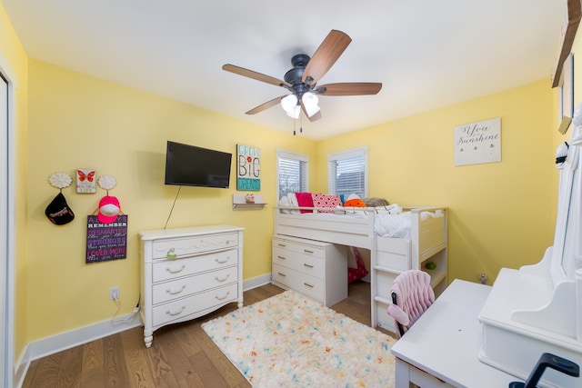 bedroom with baseboards, a ceiling fan, and wood finished floors