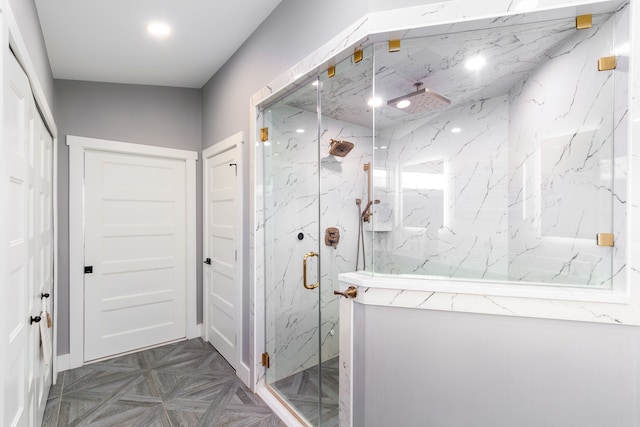 full bathroom with a marble finish shower