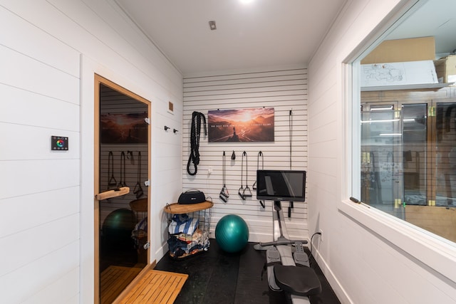 exercise room with wooden walls