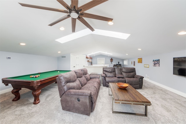 playroom with a ceiling fan, lofted ceiling with skylight, pool table, bar, and carpet