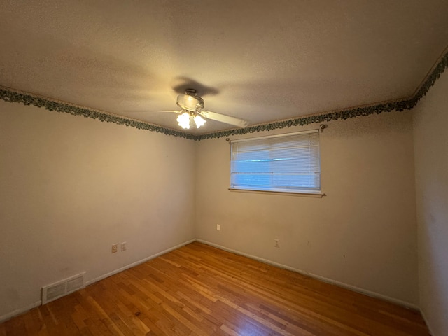 29318 Orvylle Dr, Warren, MI 48092 - spare room featuring baseboards, ceiling fan, light wood finished floors, and visible vents