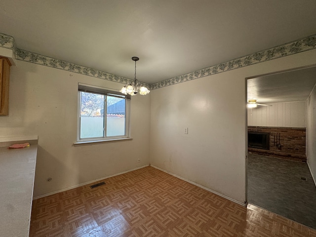 29318 Orvylle Dr, Warren, MI 48092 - unfurnished dining area featuring an inviting chandelier, a brick fireplace, and visible vents