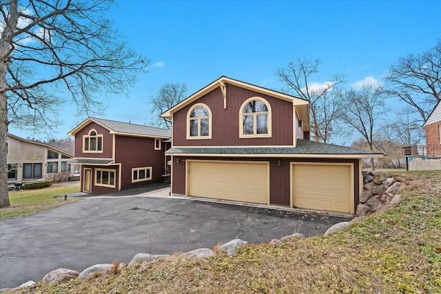 2745 Lari Ct, West Bloomfield, MI 48324 - view of front of home with a garage and driveway