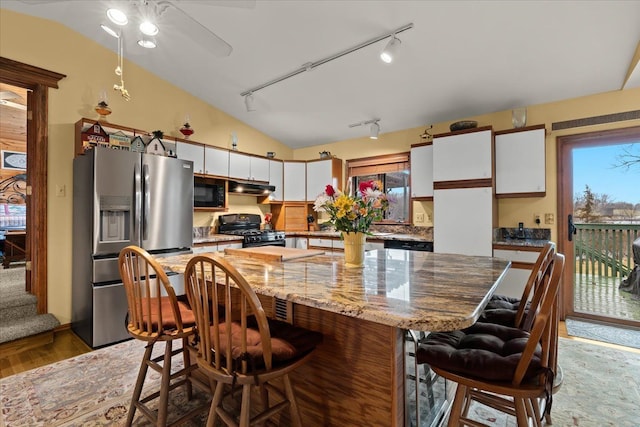 2745 Lari Ct, West Bloomfield, MI 48324 - kitchen with light wood-style flooring, black appliances, track lighting, and white cabinets