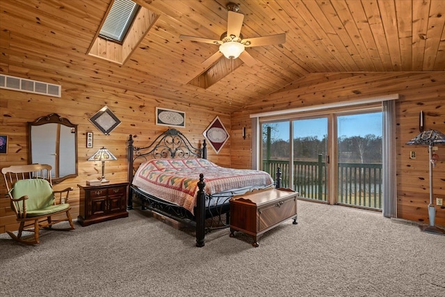 2745 Lari Ct, West Bloomfield, MI 48324 - bedroom featuring lofted ceiling with skylight, visible vents, wooden walls, access to outside, and carpet floors