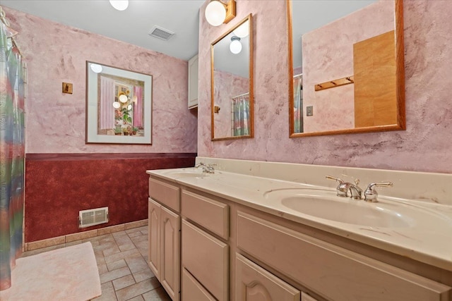 2745 Lari Ct, West Bloomfield, MI 48324 - bathroom featuring a sink, curtained shower, and visible vents