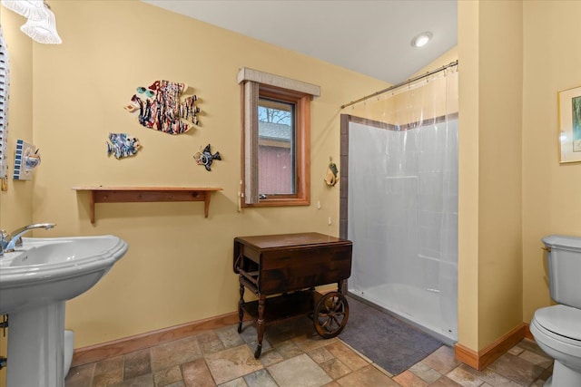 2745 Lari Ct, West Bloomfield, MI 48324 - bathroom with toilet, baseboards, stone finish flooring, and curtained shower