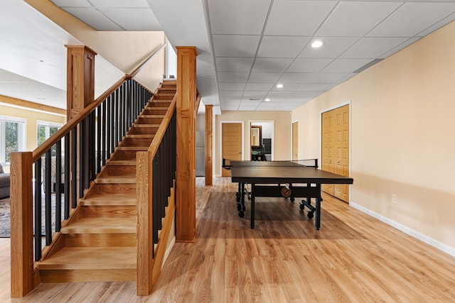 9025 Huron Bluffs Dr, White Lake, MI 48386 - playroom with baseboards, recessed lighting, a paneled ceiling, and light wood-type flooring
