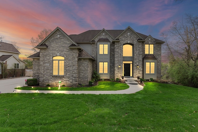 9025 Huron Bluffs Dr, White Lake, MI 48386 - french country home with a front lawn and brick siding