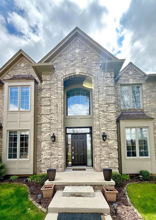 9025 Huron Bluffs Dr, White Lake, MI 48386 - doorway to property featuring brick siding