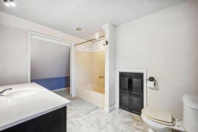 bathroom featuring visible vents, toilet, shower / bathing tub combination, vanity, and marble finish floor