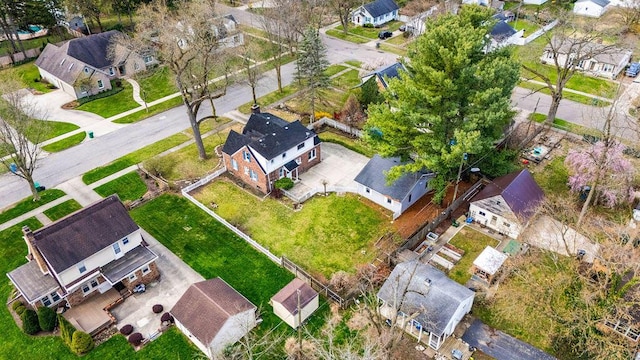 birds eye view of property with a residential view