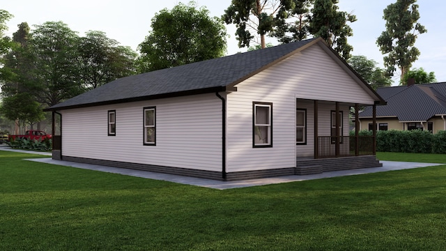 568 Jackson St, Muskegon, MI 49442 - view of home's exterior featuring a porch, roof with shingles, and a yard