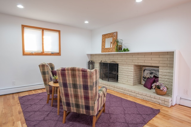29632 Pond Ridge Rd, Farmington Hills, MI 48334 - sitting room featuring recessed lighting, a baseboard radiator, wood finished floors, and a brick fireplace