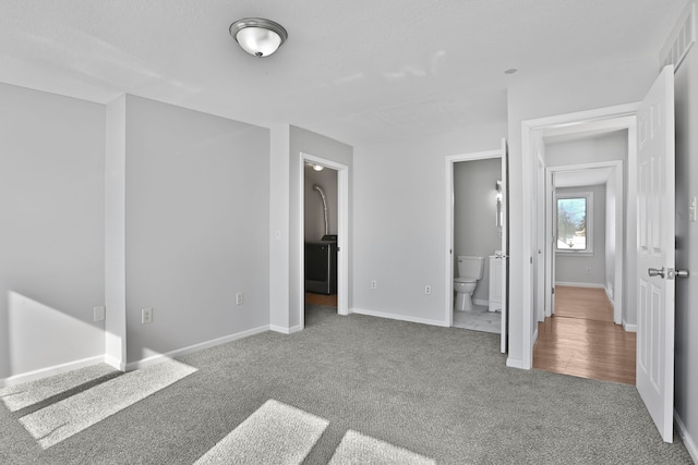 25763 Gibraltar Rd, Flat Rock, MI 48134 - unfurnished bedroom featuring carpet floors, baseboards, and connected bathroom