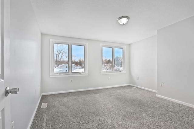 25763 Gibraltar Rd, Flat Rock, MI 48134 - carpeted empty room featuring baseboards and visible vents