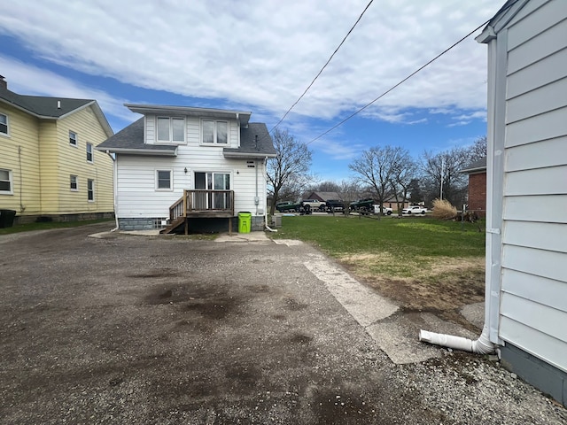 25763 Gibraltar Rd, Flat Rock, MI 48134 - rear view of house with roof with shingles