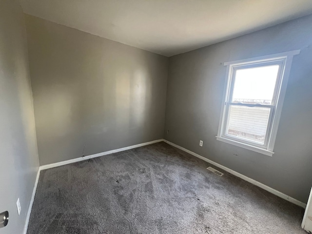 25763 Gibraltar Rd, Flat Rock, MI 48134 - spare room with visible vents, carpet, and baseboards