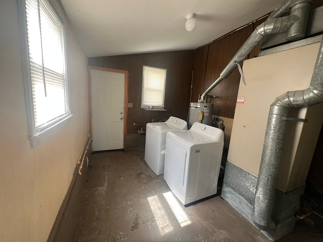25763 Gibraltar Rd, Flat Rock, MI 48134 - washroom with laundry area, water heater, independent washer and dryer, and wooden walls