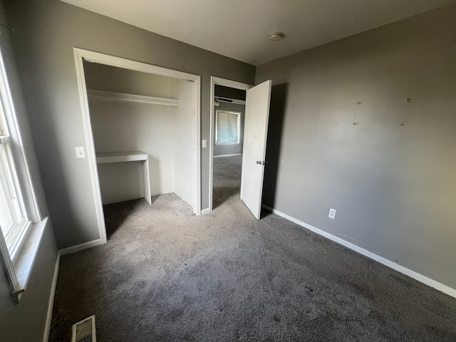 25763 Gibraltar Rd, Flat Rock, MI 48134 - unfurnished bedroom featuring carpet flooring, visible vents, multiple windows, and a closet